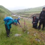 Wet but happy lichenologists by Carlin Gill